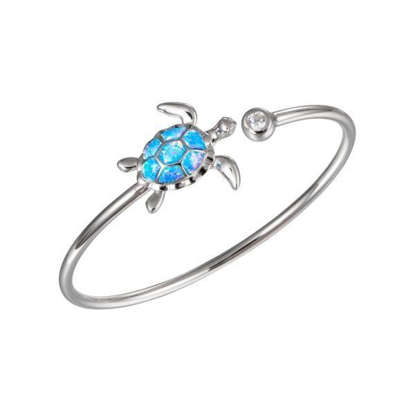 The picture shows a 925 sterling silver opalite sea turtle sleek bangle with topaz.