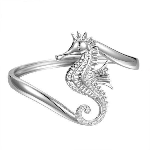 The picture shows a 925 sterling silver seahorse bangle with topaz.
