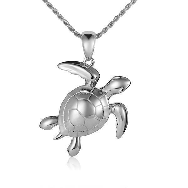 The picture shows a 14K white gold sea turtle pendant.