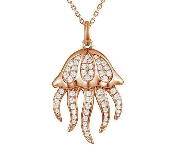 The picture shows a 925 sterling silver, rose gold plated, pavé barrel jellyfish pendant with topaz.
