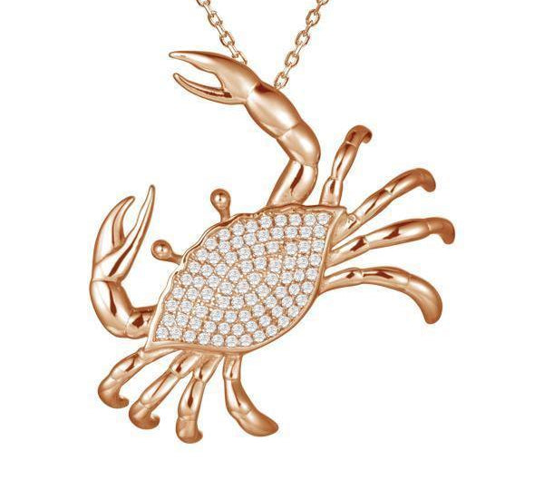 The picture shows a 925 sterling silver, rose gold plated, pavé blue crab pendant with cubic zirconia.