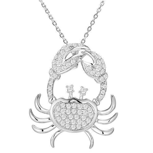 The picture shows a 925 sterling silver, white gold plated, pavé crab pendant with topaz.