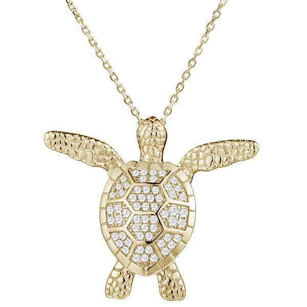 In this photo there is a yellow gold sea turtle pendant with cubic zirconia.