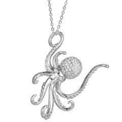 The picture shows a 925 sterling silver, white gold vermeil, pavé octopus pendant with topaz.