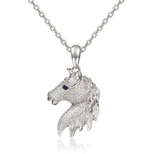 In this photo there is a sterling silver horse head pendant with sapphire and topaz gemstones.