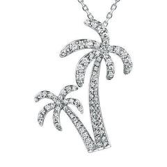 In this photo there is a white gold double palm tree pendant with topaz gemstones.