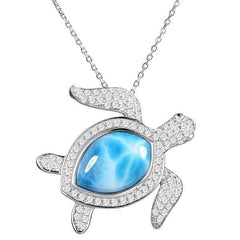 The picture shows a 925 sterling silver pavé larimar sea turtle pendant with cubic zirconia.