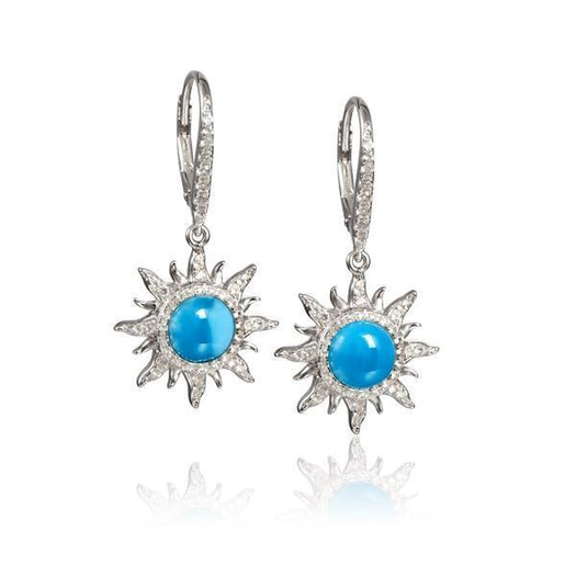 In this photo there is a pair of sterling silver sun earrings with blue larimar and topaz gemstones.