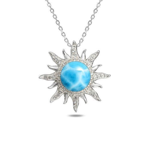 In this photo there is a sterling silver sun pendant with topaz and one blue larimar gemstone.