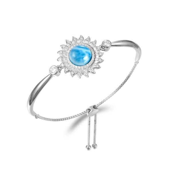 In this photo there is a 925 sterling silver sunflower bolo bracelet with one blue larimar gemstone and topaz.