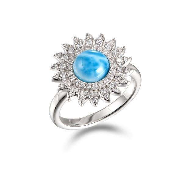 In this photo there is a 925 sterling silver sunflower ring with one blue larimar gemstone and topaz.