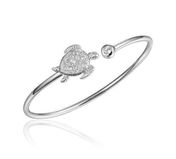 The picture shows a 925 sterling silver sea turtle bangle with topaz.