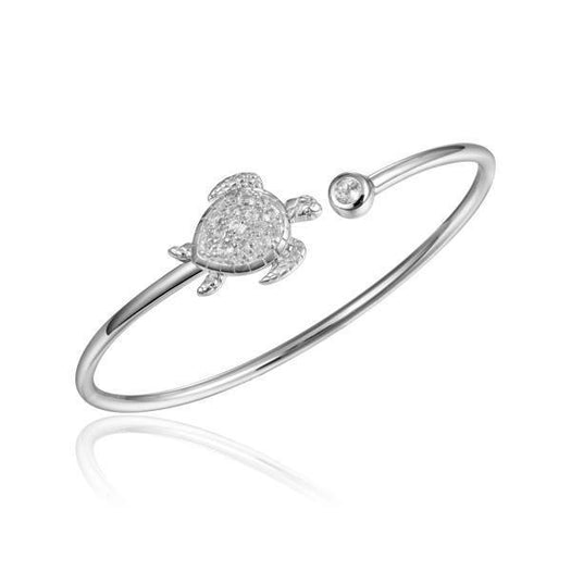 The picture shows a 925 sterling silver sea turtle bangle with topaz.