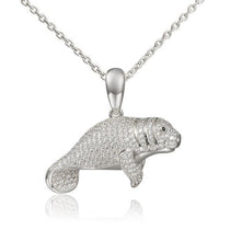 The picture shows a 925 sterling silver pavé manatee pendant with cubic zirconia.