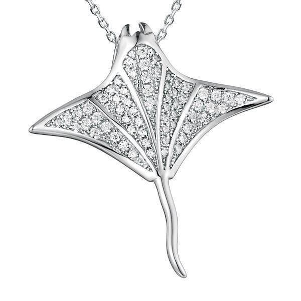 The picture shows a 925 sterling silver, white gold vermeil, pavé manta ray pendant with topaz.