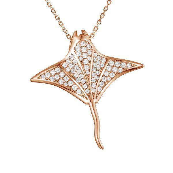 The picture shows a 925 sterling silver, rose gold vermeil, pavé manta ray pendant with topaz.