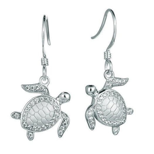 The picture shows a pair of 925 sterling silver white gold-vermeil sea turtle hook earrings with topaz.