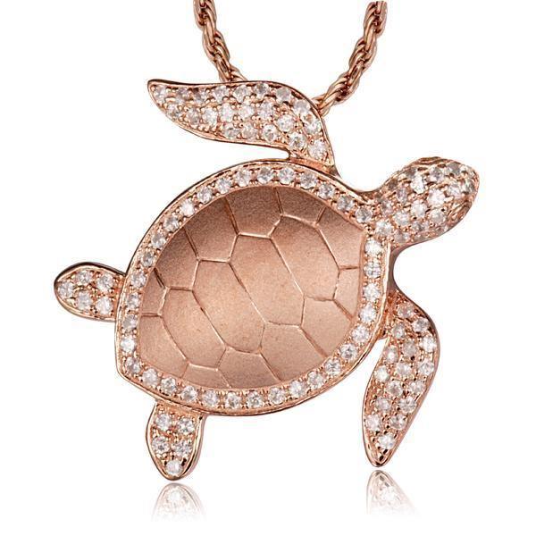 The picture shows a 14K rose gold sea turtle pendant with diamonds.