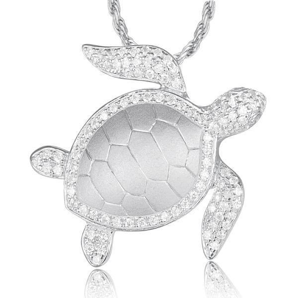 The picture shows a 14K white gold sea turtle pendant with diamonds.