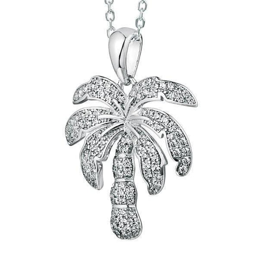 In this photo there is a white gold palm tree pendant with topaz gemstones.