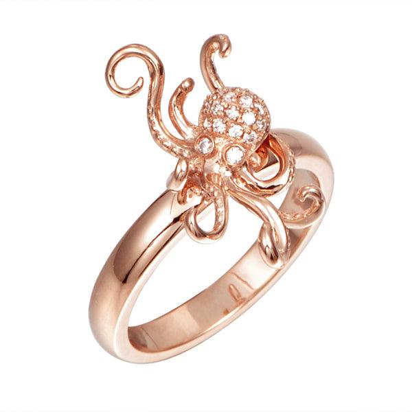 The photo shows a solid gold pavé octopus ring with diamonds.