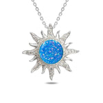 In this photo there is a sterling silver sun pendant with topaz and blue opalite gemstones.