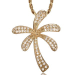 In this photo there is a yellow gold palm tree pendant with topaz gemstones.