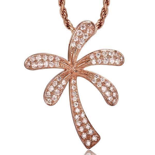 In this photo there is a rose gold palm tree pendant with diamonds.