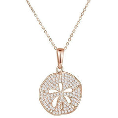 The picture shows a medium 14K rose gold pavé sand dollar pendant with diamonds.