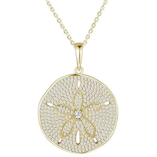 The picture shows a large 925 sterling silver, yellow gold vermeil, pavé sand dollar pendant with topaz.
