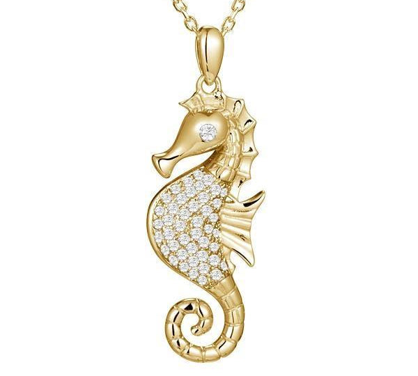 The picture shows a 925 sterling silver, yellow gold vermeil, pavé seahorse pendant with topaz.