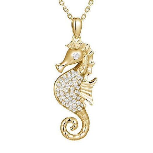 The picture shows a 925 sterling silver, yellow gold vermeil, pavé seahorse pendant with topaz.