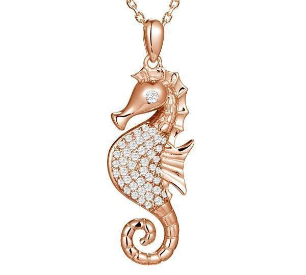 The picture shows a 925 sterling silver, rose gold vermeil, pavé seahorse pendant with topaz.