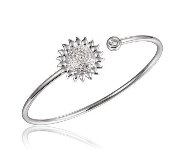 In this photo there is a sterling silver sunflower bangle with topaz gemstones.