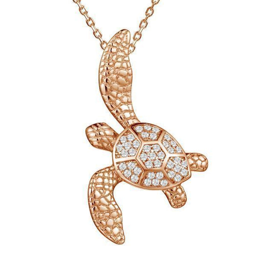 The picture shows a 925 sterling silver, rose gold vermeil, sea turtle pendant with topaz.