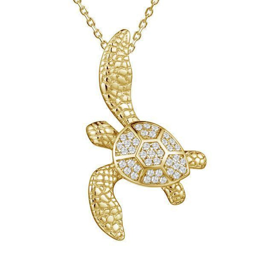 The picture shows a 925 sterling silver, yellow gold vermeil, sea turtle pendant with topaz.