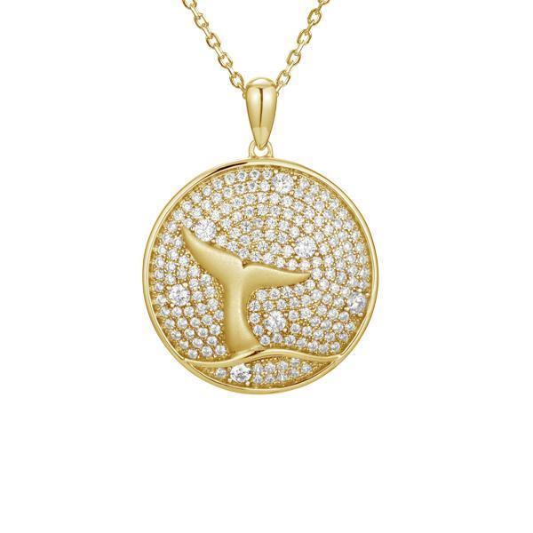 The picture shows a 925 sterling silver, yellow gold vermeil, pavé whale tail medallion pendant with topaz.