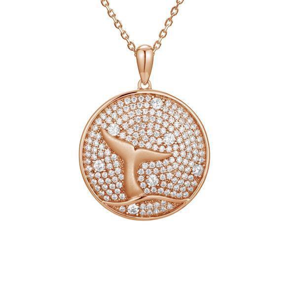 The picture shows a 925 sterling silver, rose gold vermeil, pavé whale tail medallion pendant with topaz.
