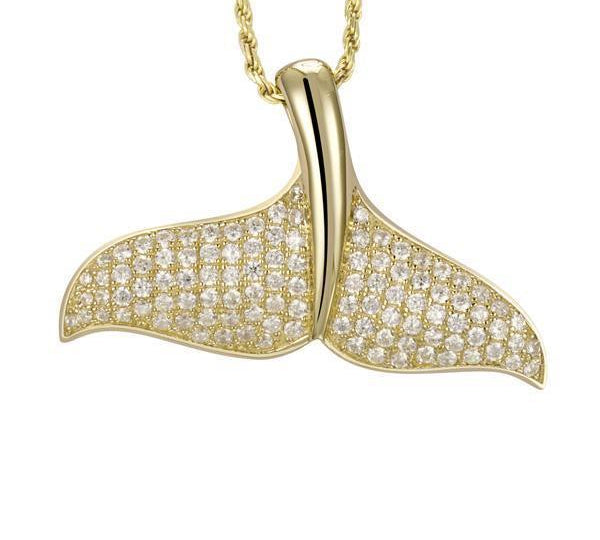 The picture shows a 925 sterling silver, yellow gold vermeil, pavé whale tail pendant with topaz.