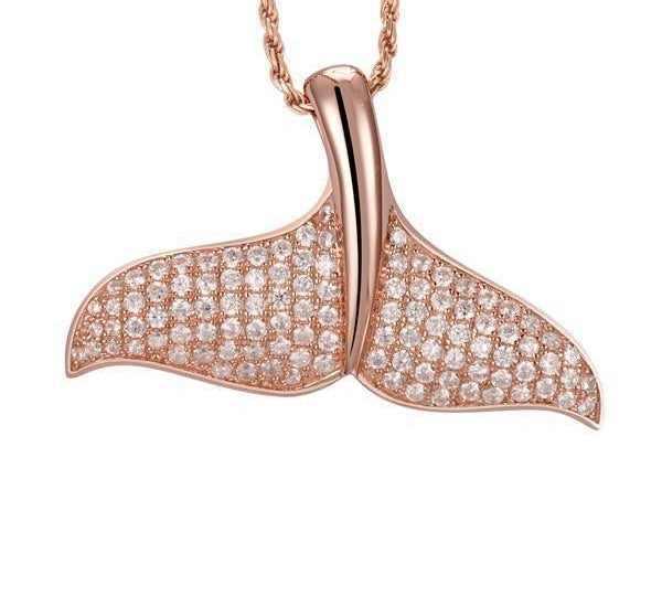 The picture shows a 925 sterling silver, rose gold vermeil, pavé whale tail pendant with topaz.