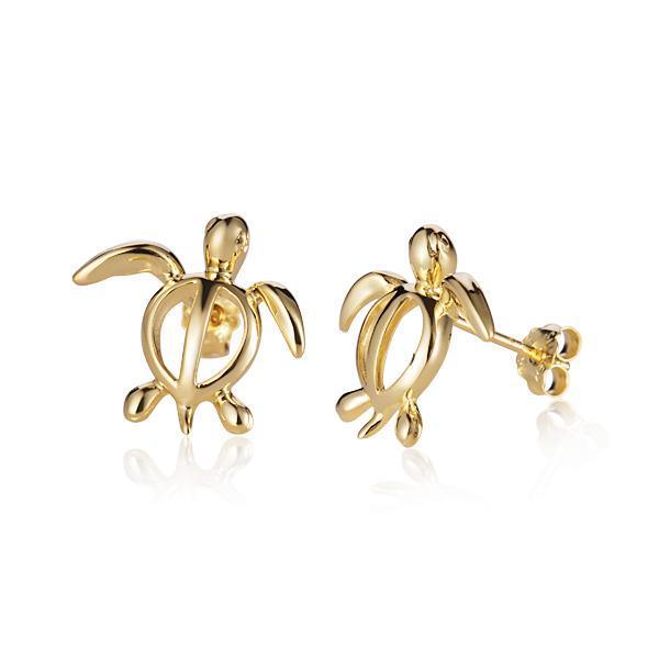 In this picture there is a pair of 14k yellow gold sea turtle stud earrings.