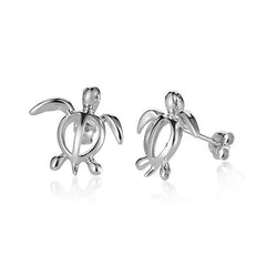 In this picture there is a pair of 14k white gold sea turtle stud earrings.