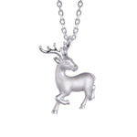 In this photo there is a sterling silver prancing reindeer pendant.