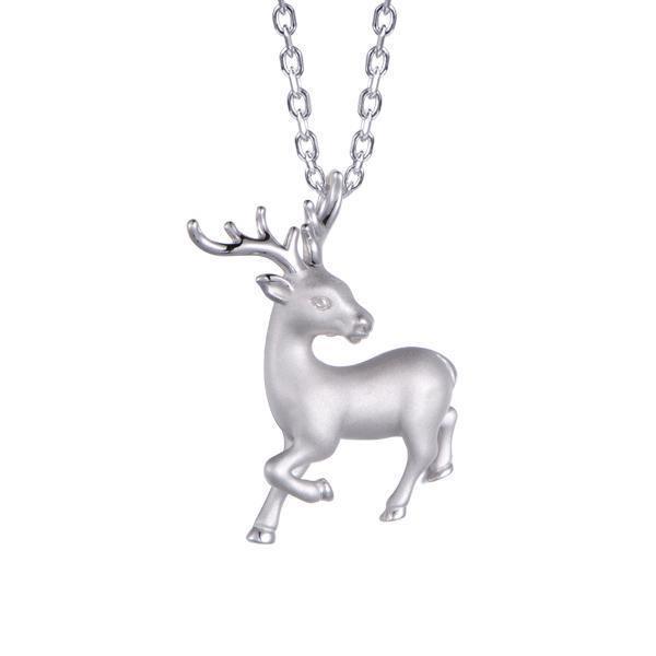 In this photo there is a sterling silver prancing reindeer pendant.