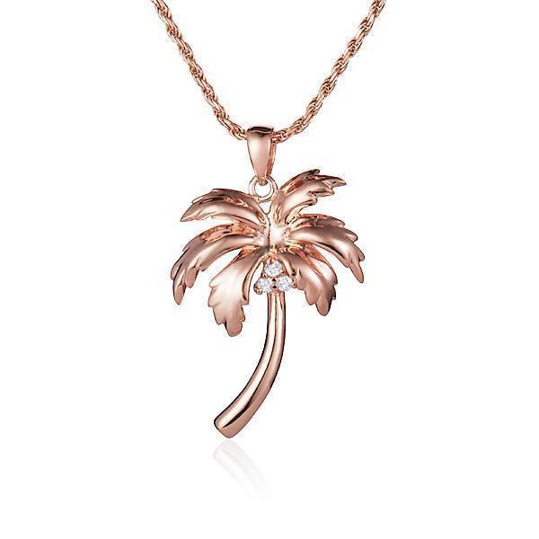 In this photo there is a rose gold queen palm tree pendant with three diamond coconuts.