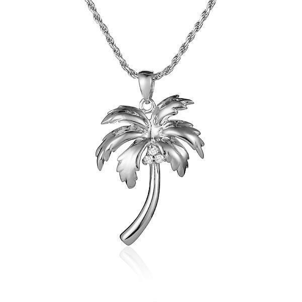 In this photo there is a white gold queen palm tree pendant with three diamond coconuts.