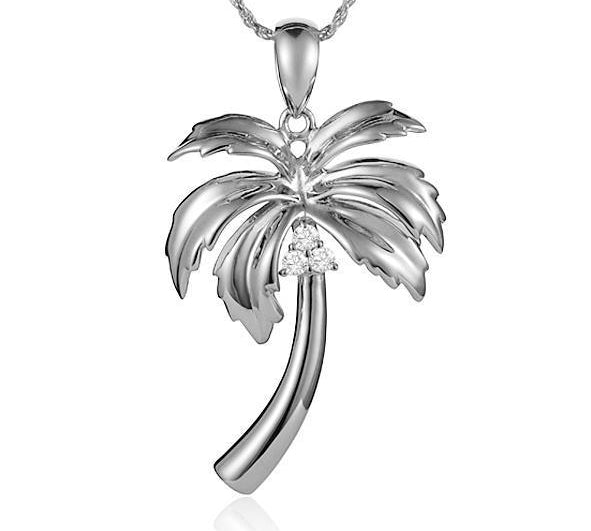 In this photo there is a sterling silver palm tree pendant with topaz gemstones.