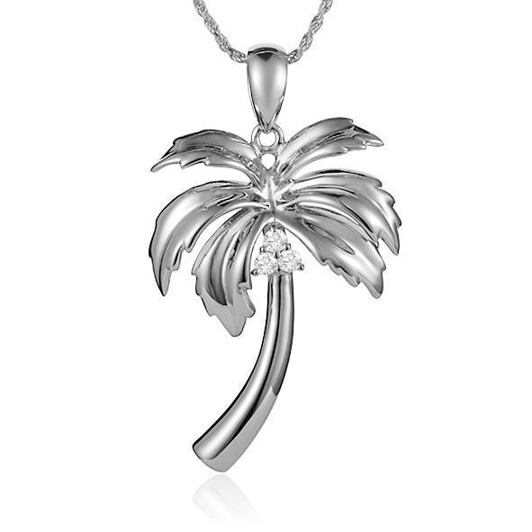 In this photo there is a sterling silver palm tree pendant with topaz gemstones.