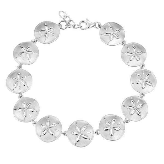 The picture shows a white gold sand dollar bracelet.