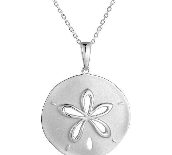 The picture shows a white gold sand dollar cut out pendant.